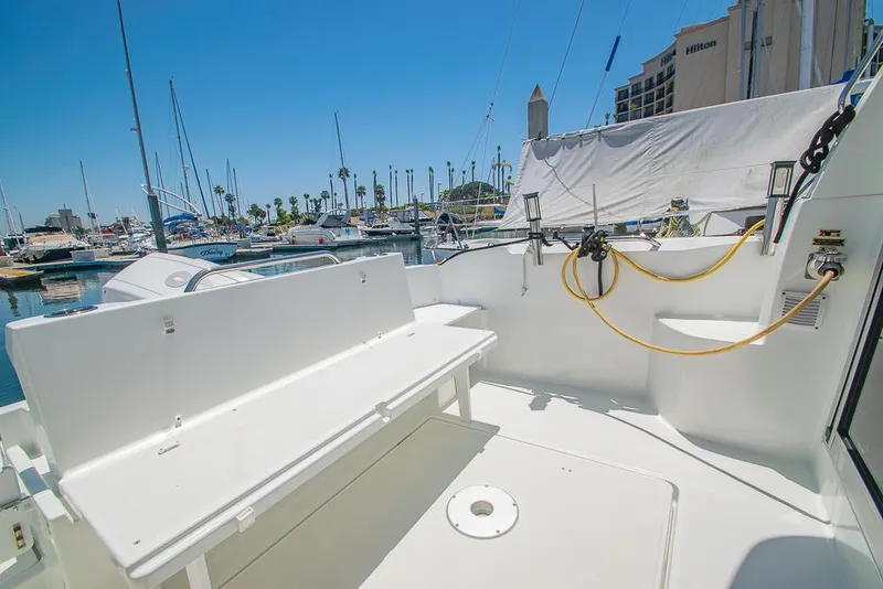 Slide: The Image of Beneteau Antares 8, 2021 model, docked at marina with clear blue sky. - 32