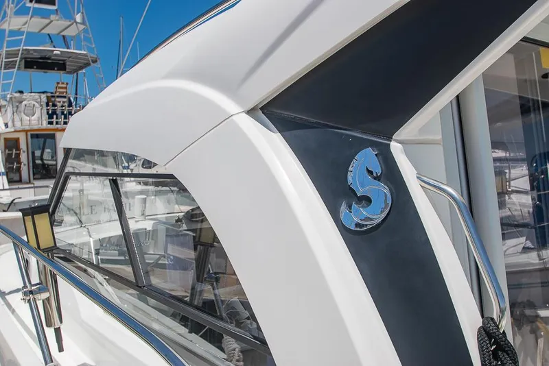 Slide: The Image of Beneteau Antares 8, 2021 model, showcasing sleek design and logo detail. - 4
