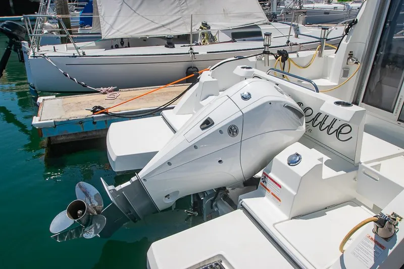 Slide: The Image of Beneteau Antares 8 (2021) motorboat docked, showcasing outboard engine and sleek design. - 41