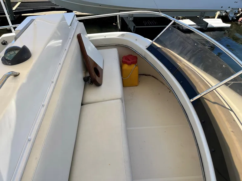 Slide: The Image of 1994 Tiara Yachts 3600 Convertible Sportfish deck with seating and storage. - 18