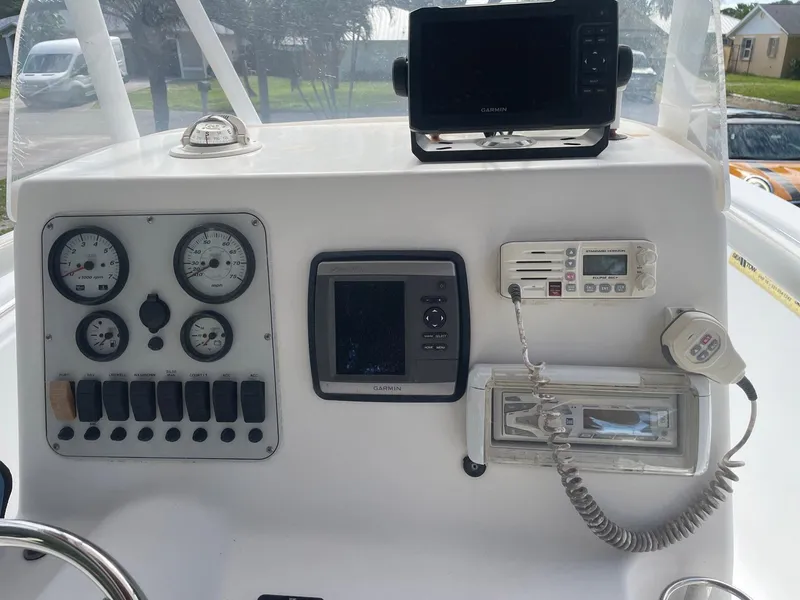 Slide: The Image of Control panel of a 2012 Tidewater 220 CC Adventure boat with navigation instruments. - 5