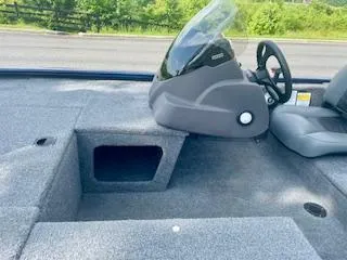 Slide: The Image of 2022 Tracker Pro 170 boat interior with steering console and seating area. - 3