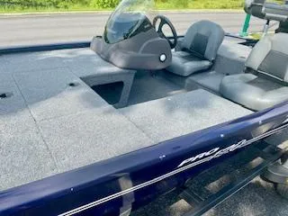 Slide: The Image of 2022 Tracker Pro 170 boat with gray seating and steering console. - 4