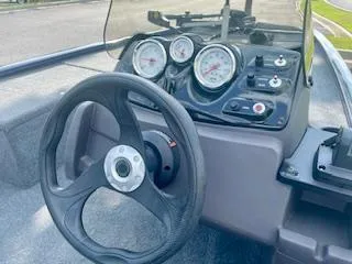 Slide: The Image of Steering console of a 2022 Tracker Pro 170 boat with gauges and controls. - 5