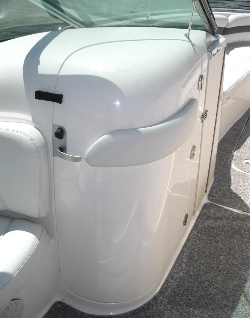 Slide: The Image of 2005 Chaparral 280 SSi boat interior, featuring sleek white design and modern amenities. - 18