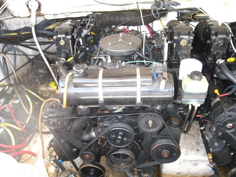 Slide: The Image of Engine compartment of a 2005 Chaparral 280 SSi boat, showcasing mechanical components and wiring. - 27