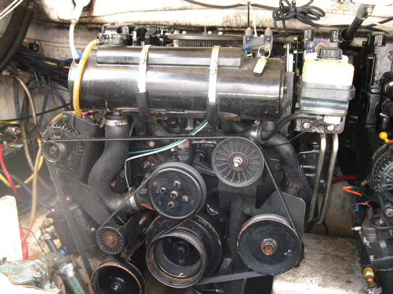 Slide: The Image of Engine of a 2005 Chaparral 280 SSi boat, showcasing mechanical components and belts. - 28