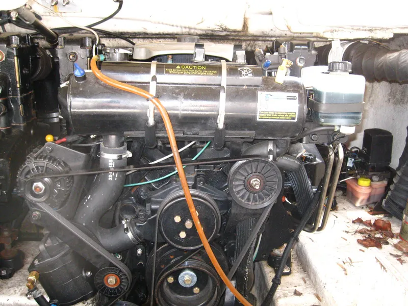 Slide: The Image of Engine compartment of a 2005 Chaparral 280 SSi boat, showcasing mechanical components. - 29