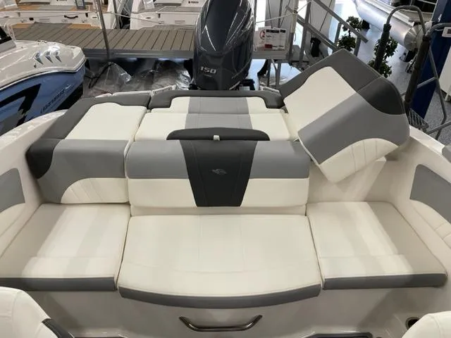 Slide: The Image of 2025 Chaparral 21 SSi OB boat interior with gray and white seating. - 10