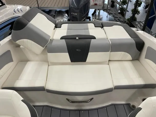 Slide: The Image of 2025 Chaparral 21 SSi OB boat interior with cushioned seating and modern design. - 11