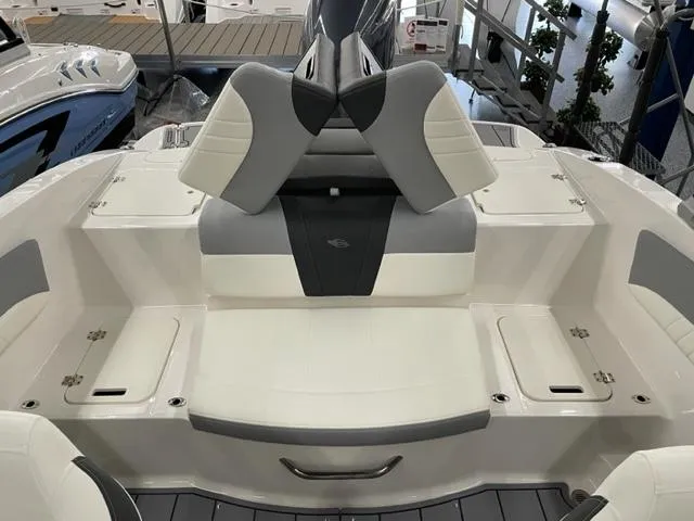 Slide: The Image of 2025 Chaparral 21 SSi OB boat interior with gray and white seating. - 12