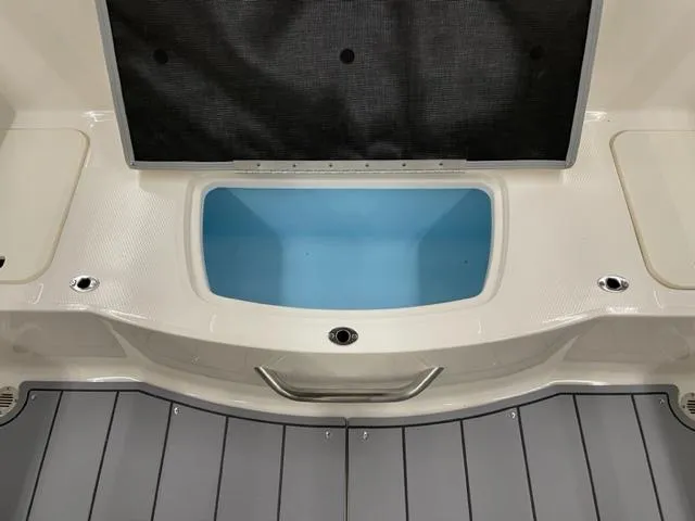 Slide: The Image of 2025 Chaparral 21 SSi OB boat interior with open storage compartment. - 13
