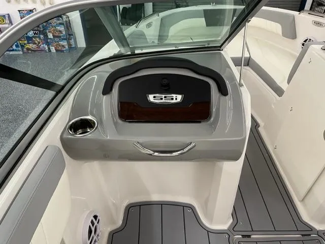 Slide: The Image of 2025 Chaparral 21 SSi OB boat interior, featuring sleek dashboard and seating area. - 8