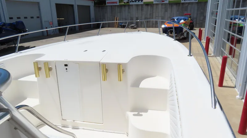 Slide: The Image of 2002 Fountain 38 TE boat deck with storage compartments and railing. - 20