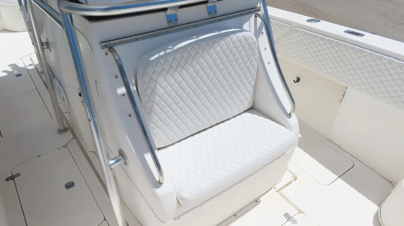 Slide: The Image of 2002 Fountain 38 TE boat with white quilted seating and stainless steel railings. - 24