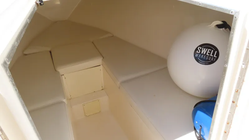 Slide: The Image of Interior cabin of 2002 Fountain 38 TE boat with seating and storage. - 26