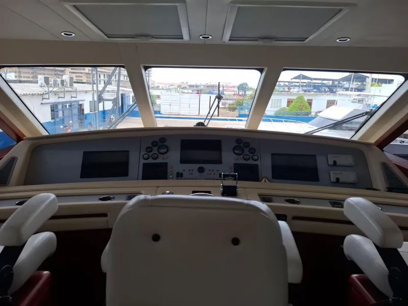 Slide: The Image of Interior view of 2007 Bertram 630E yacht cockpit with navigation controls. - 17