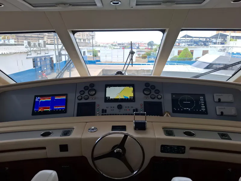 Slide: The Image of Helm of 2007 Bertram 630E yacht with advanced navigation systems. - 19