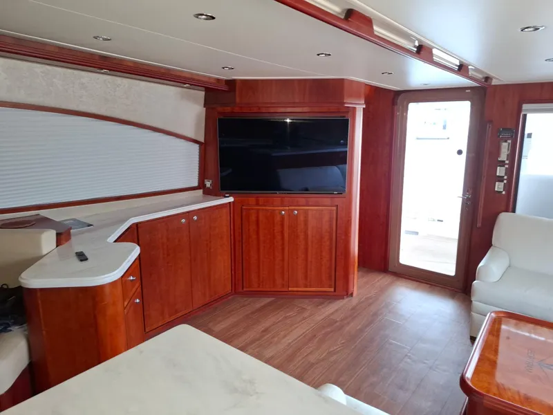 Slide: The Image of Luxurious interior of 2007 Bertram 630E yacht with wood finish and modern amenities. - 2