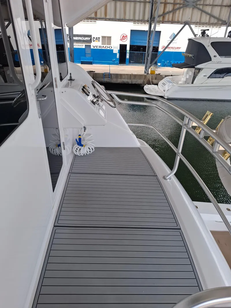 Slide: The Image of 2007 Bertram 630E yacht deck with sleek design and modern fittings. - 20