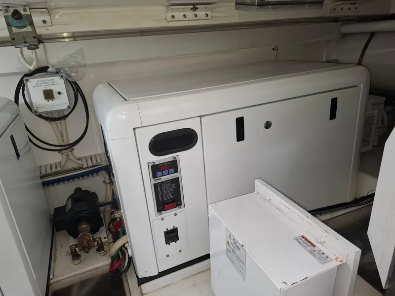 Slide: The Image of Engine room of a 2007 Bertram 630E yacht with generator and control panel. - 21