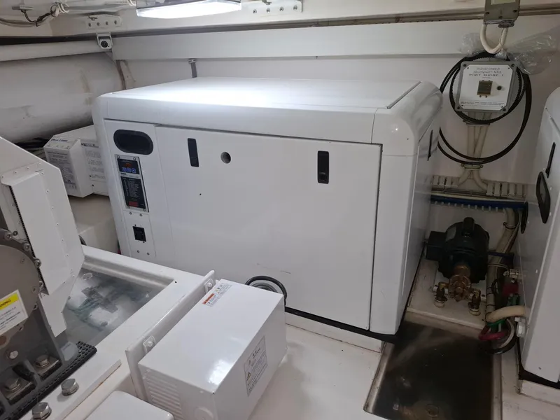 Slide: The Image of Engine room of 2007 Bertram 630E yacht with generator and equipment. - 22