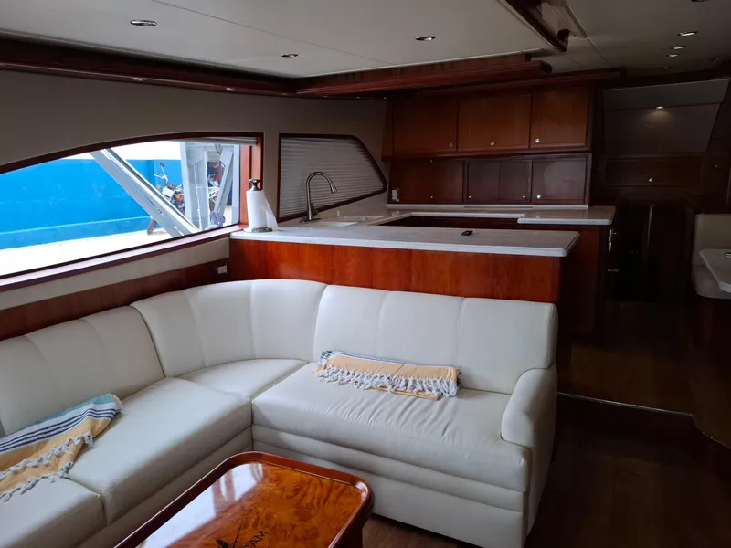 Slide: The Image of Luxurious interior of a 2007 Bertram 630E yacht with elegant seating and modern kitchen. - 3