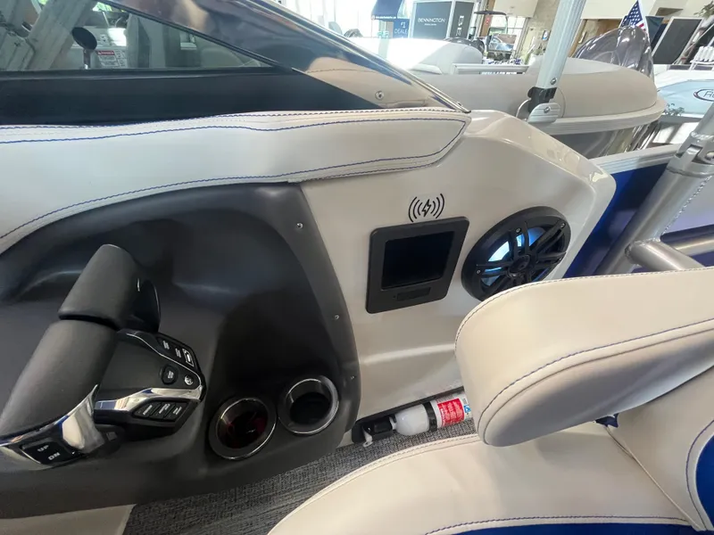 Slide: The Image of Interior of 2025 Bennington 27RSBWAT2 boat with modern controls and speaker system. - 10