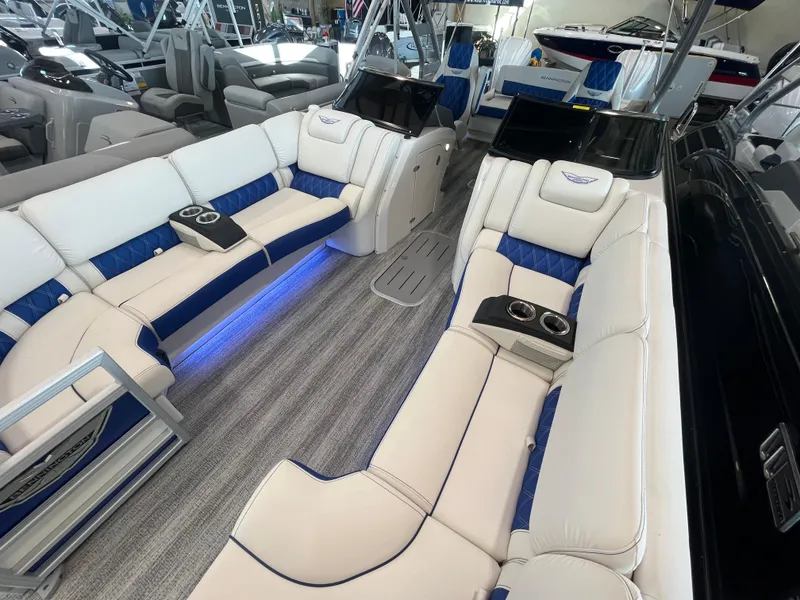 Slide: The Image of Luxurious 2025 Bennington 27RSBWAT2 boat interior with plush seating and ambient lighting. - 3