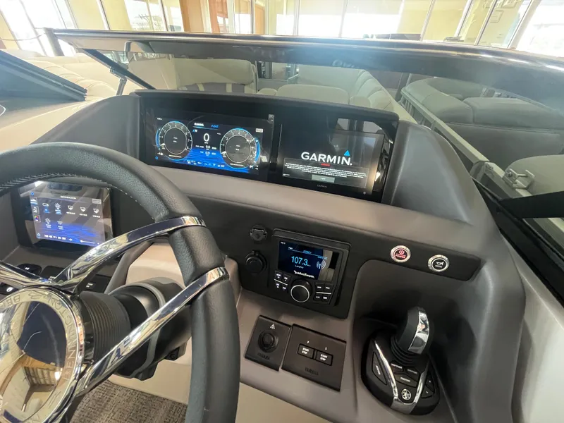 Slide: The Image of 2025 Bennington 27RSBWAT2 boat dashboard with Garmin navigation and modern controls. - 8