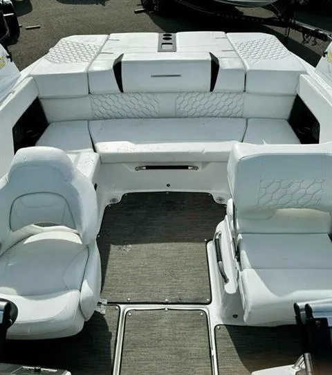 Slide: The Image of 2023 Four Winns H2 boat interior with white seating and modern design. - 10