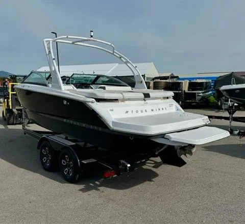 Slide: The Image of 2023 Four Winns H2 boat on trailer, rear view, in outdoor setting. - 6