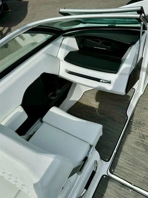 Slide: The Image of 2023 Four Winns H2 boat interior with white seating and sleek design. - 8