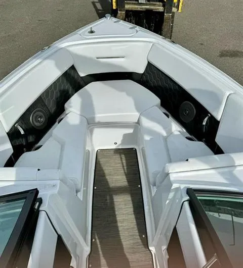 Slide: The Image of 2023 Four Winns H2 boat interior with white seating and modern design. - 9