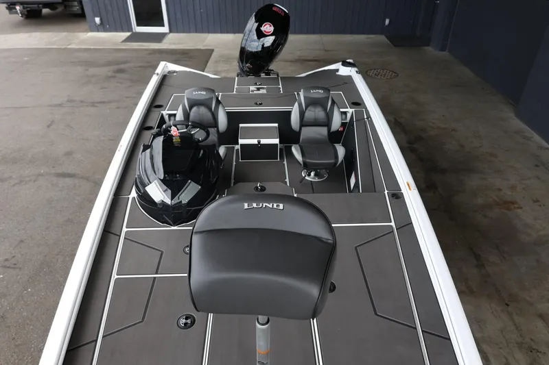 Slide: The Image of 2025 Lund 1875 Renegade SS fishing boat interior with seating and console. - 13