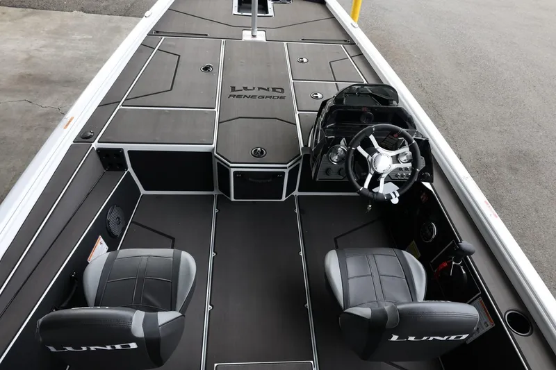 Slide: The Image of 2025 Lund 1875 Renegade SS boat interior with dual seats and steering console. - 14