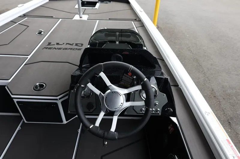 Slide: The Image of 2025 Lund 1875 Renegade SS boat interior with steering wheel and console. - 15