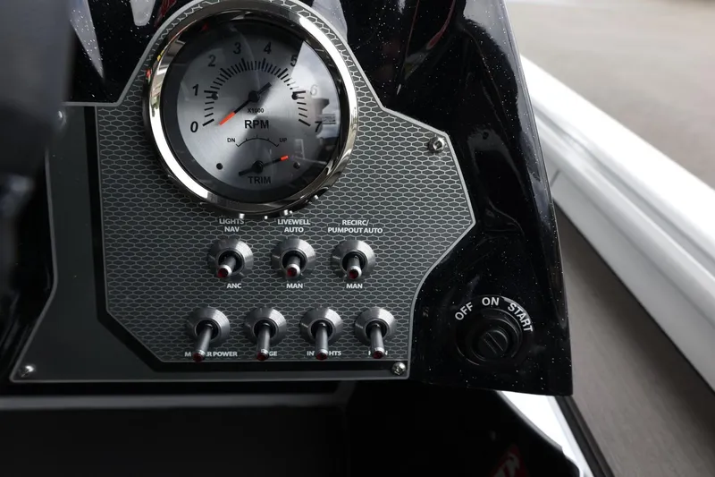 Slide: The Image of Control panel of 2025 Lund 1875 Renegade SS boat with RPM gauge and switches. - 16