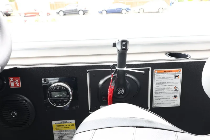 Slide: The Image of Control panel of 2025 Lund 1875 Renegade SS boat with throttle and gauges. - 19