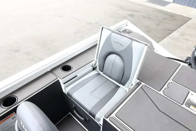 Slide: The Image of 2025 Lund 1875 Renegade SS boat seat with storage and cup holders. - 23