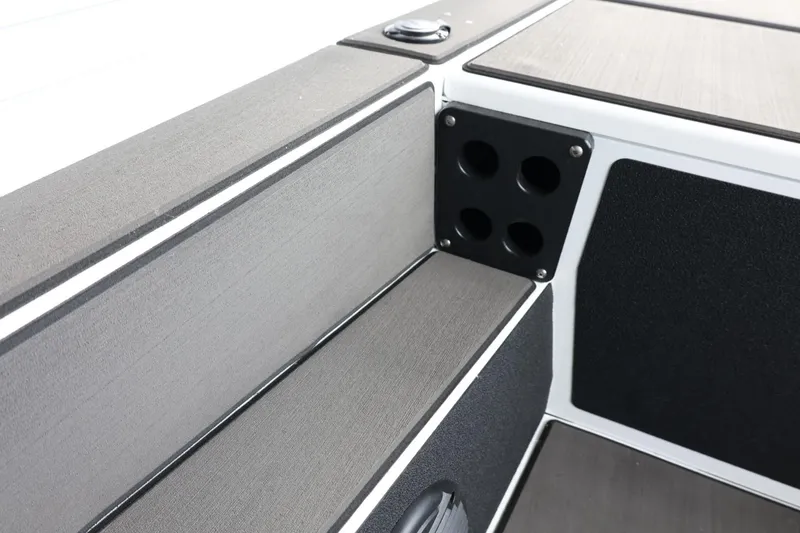 Slide: The Image of 2025 Lund 1875 Renegade SS boat interior with rod holders and sleek design. - 26