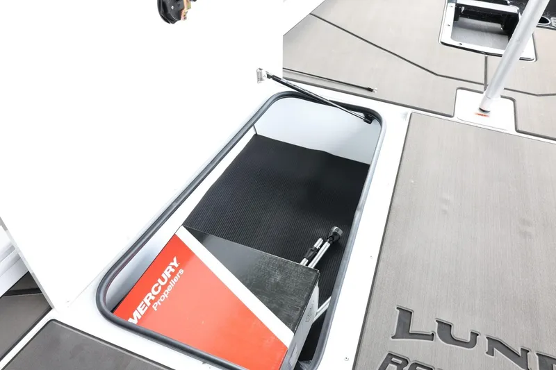 Slide: The Image of 2025 Lund 1875 Renegade SS boat storage compartment with Mercury equipment. - 28