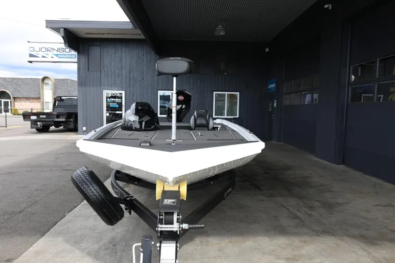 Slide: The Image of 2025 Lund 1875 Renegade SS boat on trailer at dealership. - 3