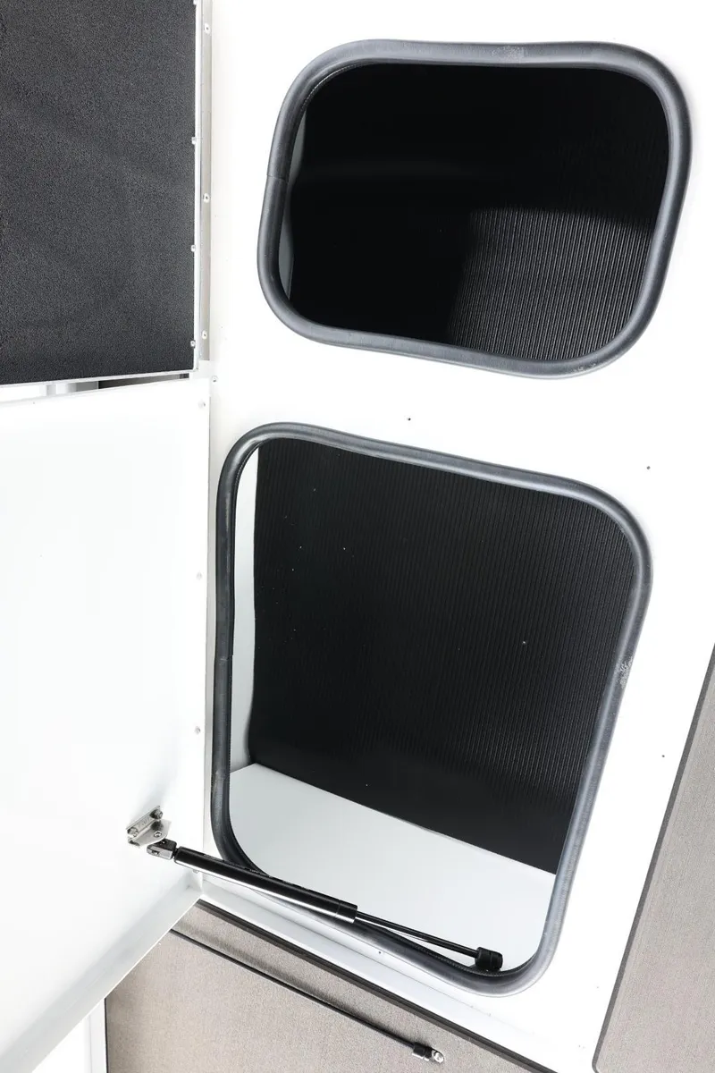 Slide: The Image of 2025 Lund 1875 Renegade SS storage compartments with open doors, showcasing interior space. - 30