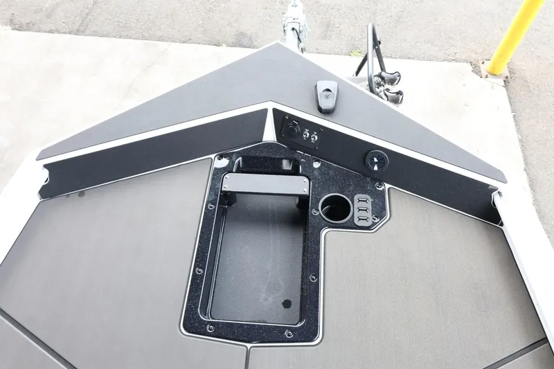 Slide: The Image of 2025 Lund 1875 Renegade SS boat deck with storage compartment and control panel. - 31