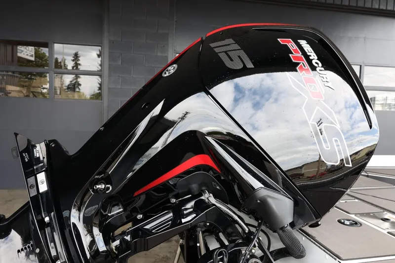 Slide: The Image of 2025 Lund 1875 Renegade SS with Mercury Pro XS outboard motor, sleek black design. - 8