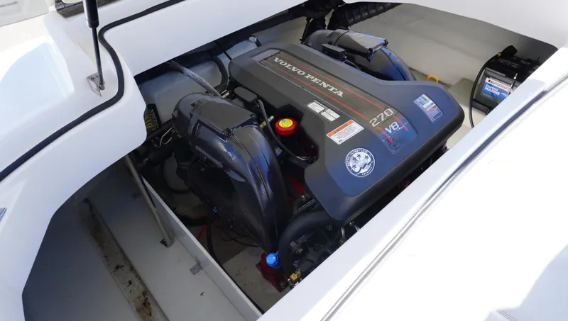 Slide: The Image of Volvo Penta engine in 2014 Cobalt 210 boat, showcasing powerful marine performance. - 12