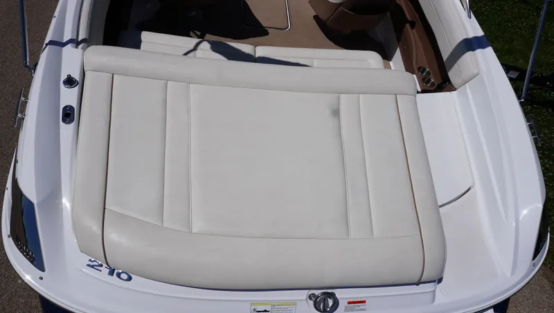 Slide: The Image of 2014 Cobalt 210 boat with white leather seating and sleek design. - 16