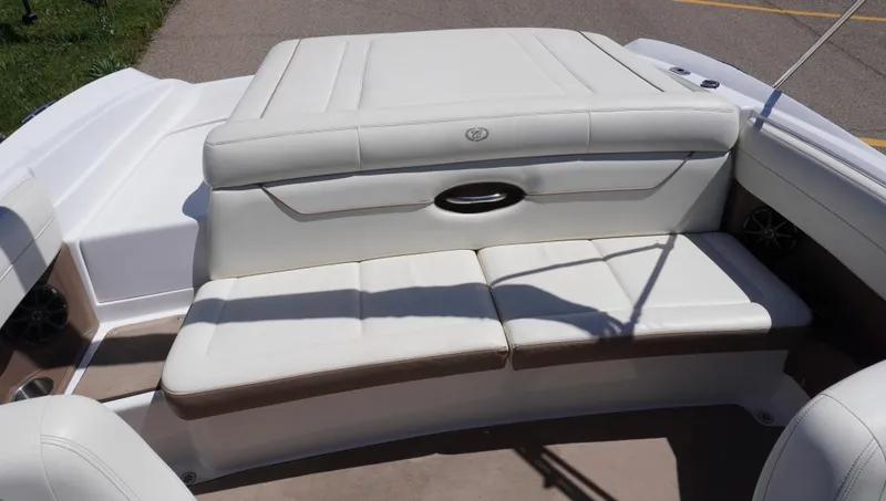 Slide: The Image of 2014 Cobalt 210 boat interior with white leather seating and sleek design. - 20