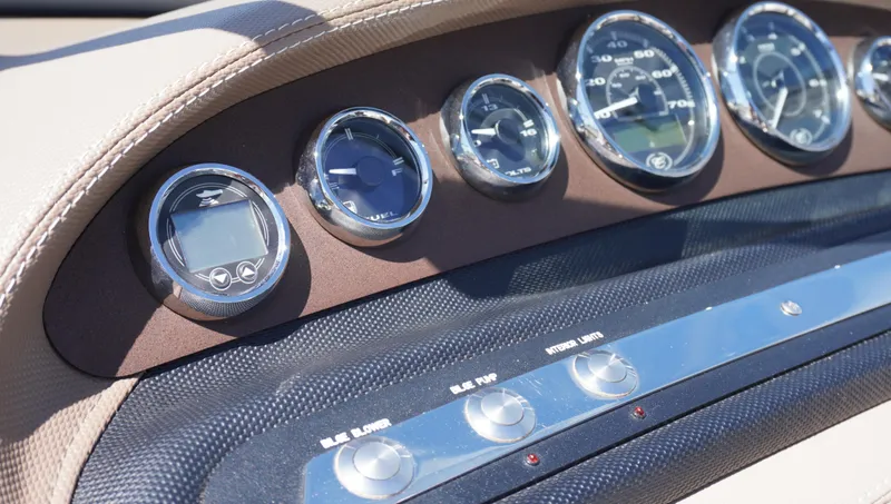 Slide: The Image of Dashboard of a 2014 Cobalt 210 boat with multiple gauges and controls. - 27